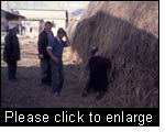 A farmer is surprised that the monitoring team assesses the quality of his hay so cautiously. Issyk Kul province, Kyrgyzstan. 